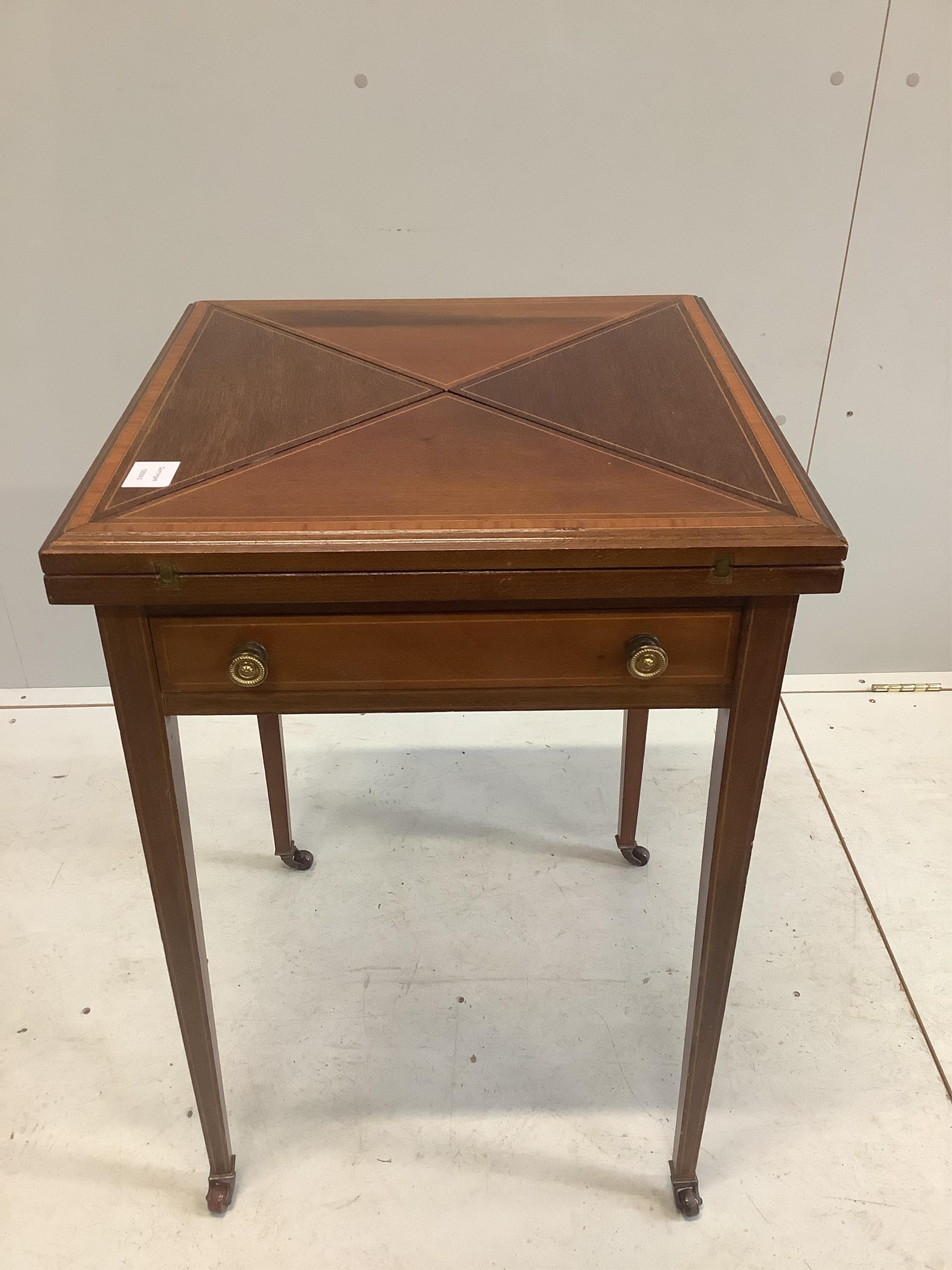 An Edwardian inlaid mahogany envelope card table, width 51cm, depth 51cm, height 75cm. Condition - good